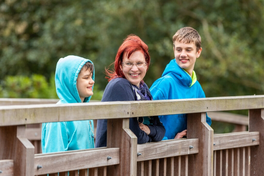Mum and two boys on bridge